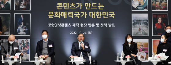 First Vice Minister of the Ministry of Culture and Tourism Jeon Byung-geuk, center, speaks during a press conference held at the CJ ENM Studio Center in Paju, Gyeonggi, on Tuesday. [YONHAP]