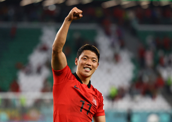 Hwang Hee-chan celebrates after scoring a crucial injury time goal to lead Korea to a 2-1 win over Portugal and advance out of the group stage at the 2022 Qatar World Cup on Dec. 2.  [REUTERS/YONHAP]