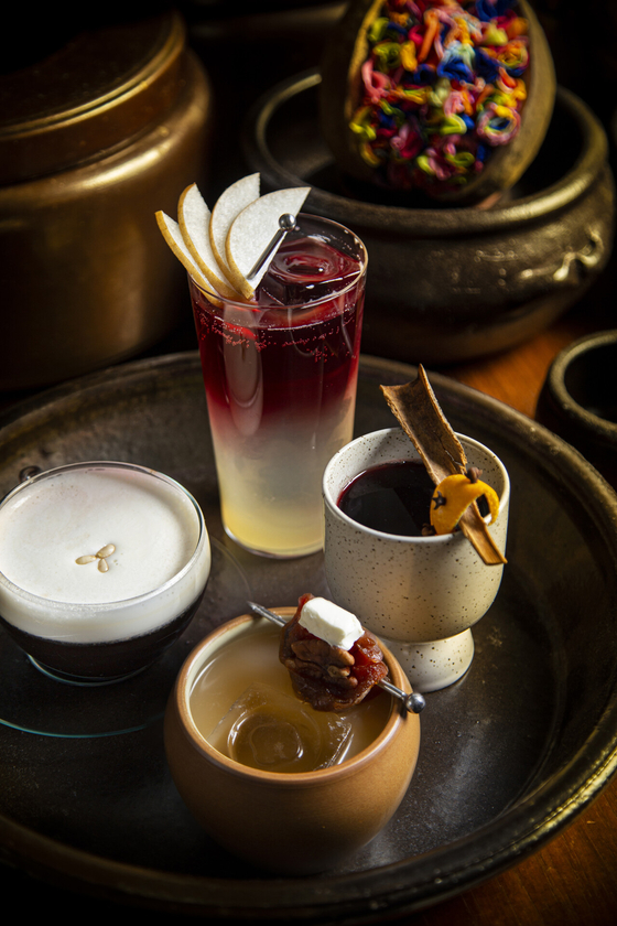 Mulled wine (far right) and boyag (far left) are part of the seasonal menu at bar OUL in Four Seasons Hotel in Jongno District, central Seoul [FOUR SEASONS HOTEL SEOUL]