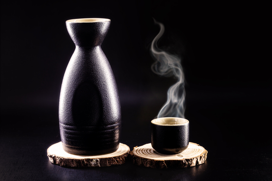 Sake is heated by boiling it inside dokuri, a long earthenware bottle [SHUTTERSTOCK]