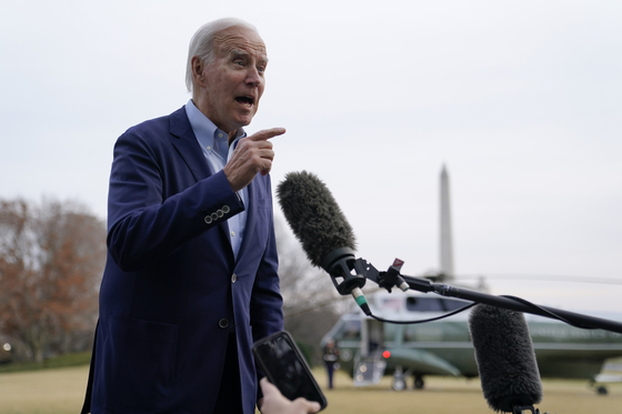 U.S. President Joe Biden speaks with reporters after stepping off Marine One on the South Lawn of the White House in Washington on Monday. [AP/YONHAP] 