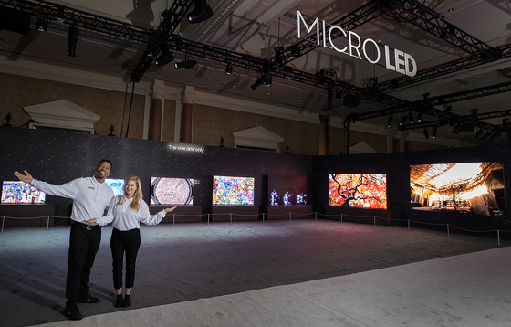 Models pose with the different sizes of Micro LED TVs Tuesday in Las Vegas. Samsung brought seven different sizes of the TVs ahead of the upcoming CES. [SAMSUNG ELECTRONICS]