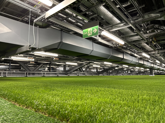 The Tottenham Hotspur football pitch is stored inside an underground parking lot known as the ″pitch pocket″ at Tottenham Hotspur Stadium in London on Dec. 5.  [JINSIL YU]