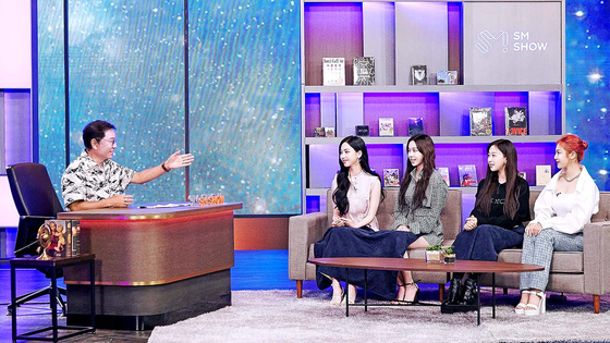 Lee Soo-man, far left, speaks with his metaverse girl group aespa at online event “SM Congress 2021” [SM ENTERTAINMENT]