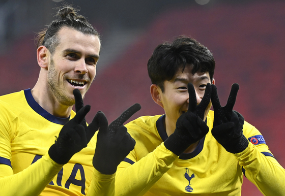Gareth Bale, left, and Son Heung-min celebrate a goal for Tottenham Hotspur against Wolfsberger AC in the Europa League on Feb. 18, 2021.  [EPA/YONHAP]