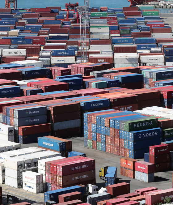 Containers are stacked at a pier in the port city of Busan on Oct. 11, 2022. [YONHAP]
