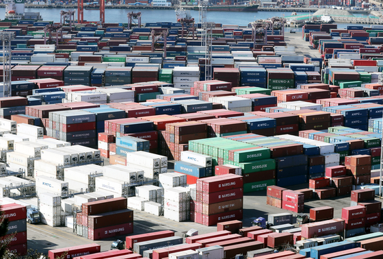 Containers are stacked at a port in Busan on Jan. 10. [YONHAP]