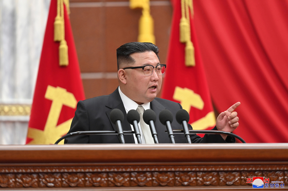 Kim Jong-un speaks at a plenary meeting of the ruling Workers' Party of Korea on Jan. 1, raising the need to exponentially increase the number of its nuclear arsenal. [KOREAN CENTRAL NEWS AGENCY] 