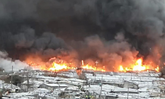 Fire breaks out in the fourth district of Guryong village, Gangnam in southern Seoul, on Friday morning. [YONHAP]