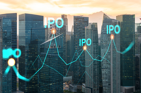 Hologram of IPO glowing icon, sunset panoramic city view of Singapore [SHUTTERSTOCK]