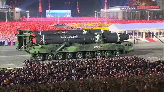 A military parade takes place in Pyongyang on April 25, when the regime displayed a Hwasong-15 intercontinental ballistic missile. The North reported its first suspected major outbreak of Covid-19 shortly thereafter. [YONHAP] 