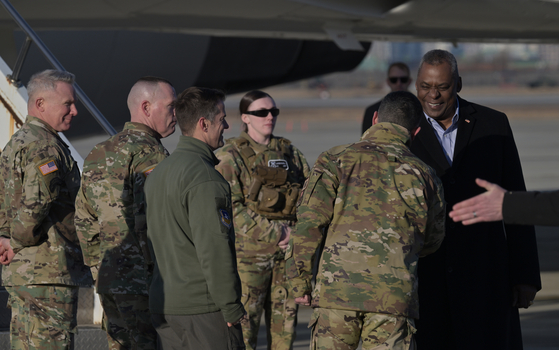 U.S. Defense Secretary Lloyd Austin, right, greeted by U.S. military officials including U.S. Forces Korea Commander General Paul LaCamera on arriving in Korea at Osan Air Base on Monday. Austin, who got off the E-4B Nightwatch plane, is on a tour visiting Seoul as well as Manila. According to the U.S. Defense Department, Austin is seeking stronger ties in the region in deterring threats from China and North Korea. This is Austin’s first visit to Seoul since President Yoon Suk Yeol took office in May 2022. [JOINT PRESS CORPS]