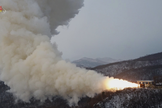 A solid-fuel engine for a "new-type strategic weapons system" is tested on Dec. 15 in this footage broadcast by Pyongyang's state-controlled Korean Central News Television (KCTV). [YONHAP]