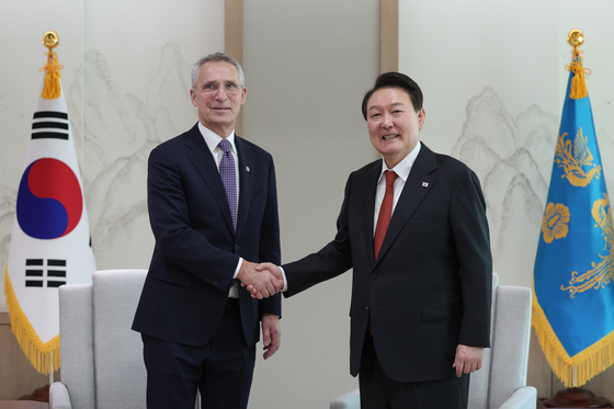 NATO Secretary General Jens Stoltenberg, left, poses for a photo with President Yoon Suk Yeol at the presidential office in Yongsan District, central Seoul on Monday. [PRESIDENTIAL OFFICE]