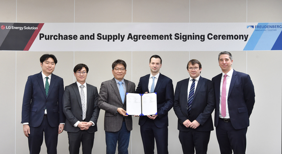 Officials from LG Energy Solution and Freudenberg e-Power Systems take a photo after signing a battery module deal. [LG ENERGY SOLUTION]