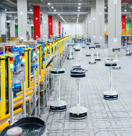 Dozens of sorting robots occupy the first floor to sort the packaged items accordingly based on its shipping regions at Coupang's fulfillment center in Daegu. [COUPANG]