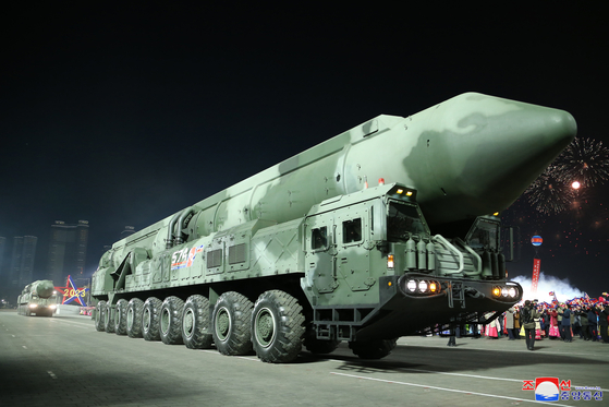 A photo released by the Korean Central News Agency (KCNA) shows a vehicle carrying a mock-up of a solid-fuel intercontinental missile under development at a military parade in Kim Il Sung Square in downtown Pyongyang on Wednesday evening. [YONHAP]