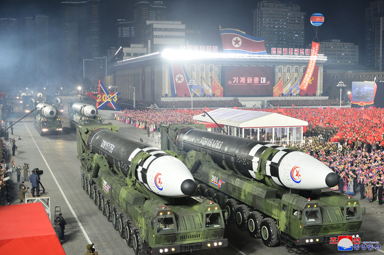 A photo released by the Korean Central News Agency (KCNA) shows a procession of Hwasong-17 intercontinental ballistic missiles (ICBM) at a military parade marking the 75th anniversary of the founding of the Korean People's Army in Kim Il Sung Square in downtown Pyongyang on Wednesday evening. [YONHAP]