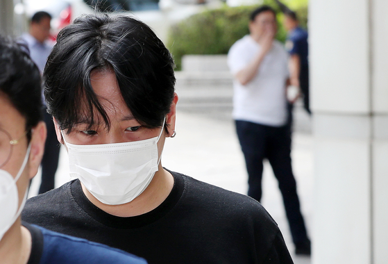 Kim Him-chan, a former member of the boy band B.A.P, appears for his trial on charges of sexual harassment at the Seoul Central District Court in Seocho District, southern Seoul [NEWS1]