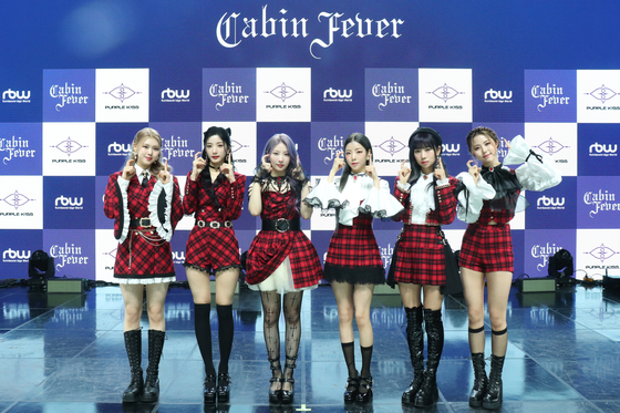 Girl group Purple Kiss poses for cameras at the showcase for its fifth EP ″Cabin Fever″ on Wednesday. [RBW]
