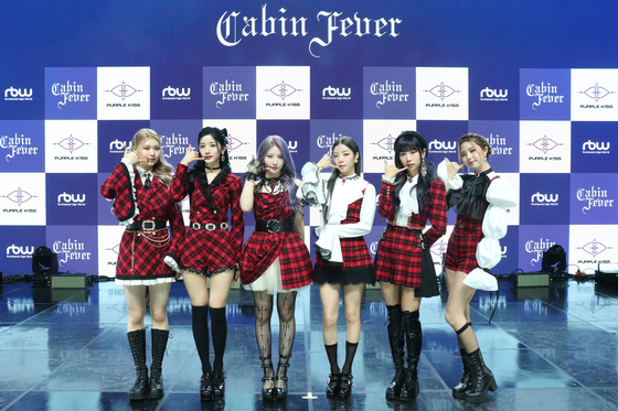 Girl group Purple Kiss poses for cameras at the showcase for its fifth EP ″Cabin Fever″ on Wednesday. [RBW]