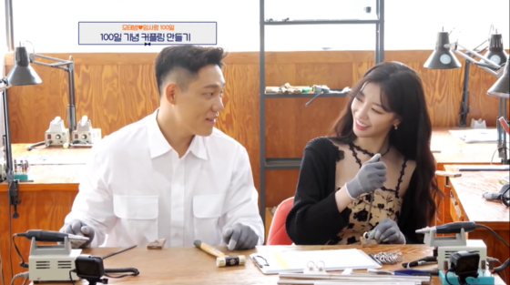 "Groom Class" (translated), a dating reality show on Channel A, shows a couple celebrate their 100th day of dating by going to a jewelry workshop to make couple rings. [SCREEN CAPTURE]