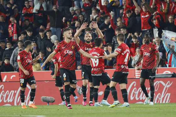 Mallorca players celebrate after scoring their third goal against Villarreal during a La Liga game in Mallorca, Spain on Saturday. [EPA/YONHAP]