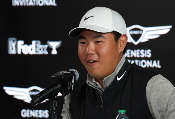 Tom Kim speaks to the media at a press conference during a pro-am before the Genesis Invitational at Riviera Country Club on Wednesday in Pacific Palisades, California.  [GETTY IMAGES]