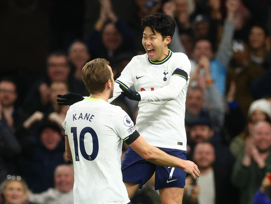 Tottenham Hotspur's Son Heung-min celebrates with Harry Kane after scoring against West Ham during a Premier League game at Tottenham Hotspur Stadium in London on Sunday.  [REUTERS/YONHAP]