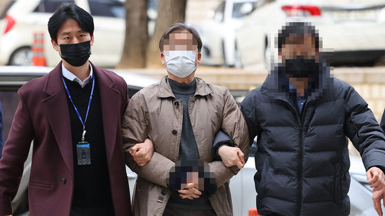 One of four South Korean activists accused of inciting sedition on behalf of North Korea enters Seoul Central District Court in Seocho District, southern Seoul on Jan. 31. [YONHAP]