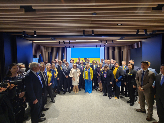 Ambassadors and diplomats of over 30 countries join the opening ceremony of a photo exhibition dedicated to Ukraine at the Seoul Square as the country marks the first year of invasion by Russia on Friday. [ESTHER CHUNG]