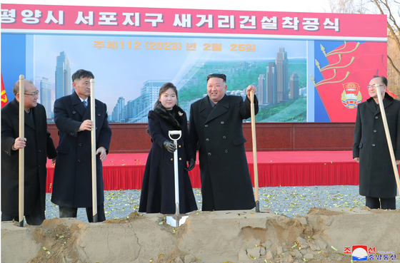 North Korean leader Kim Jong-un with daughter Kim Ju-ae during a construction project groundbreaking ceremony held in Pyongyang on Saturday. [KOREAN CENTRAL NEWS AGENCY]
