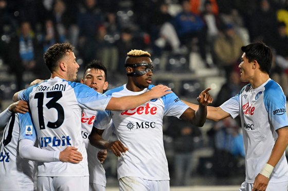 Napoli's Victor Osimhen, center, celebrate with Kim Min-jae, right, after Empoli's defender Ardian Ismajli scored an own goal during a Serie A match in Empoli, Italy on Saturday.  [AFP/YONHAP]