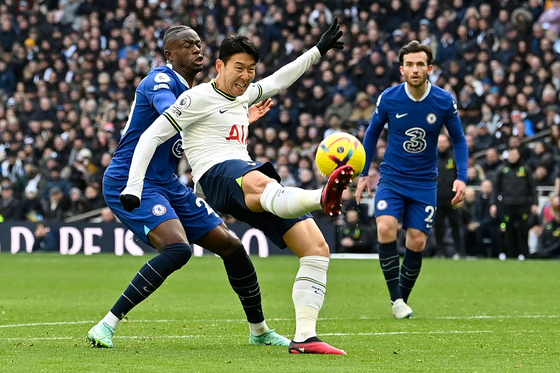 Tottenham Hotspur's Son Heung-min clears the ball during a Premier League match against Chelsea at Tottenham Hotspur Stadium in London on Sunday.  [AFP/YONHAP]