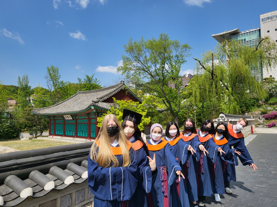 Students at the Korea Language Center at Sungkyunkwan University pose for a photo at their graduation ceremony early this year. [SUNGKYUNKWAN UNIVERSITY]