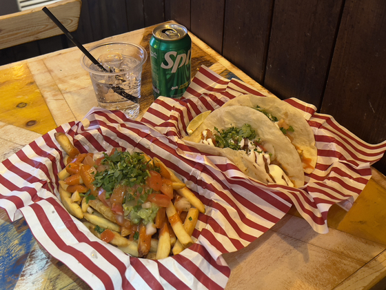 Publico Taco's carnitas tacos and guacamole fries [LEE TAE-HEE]