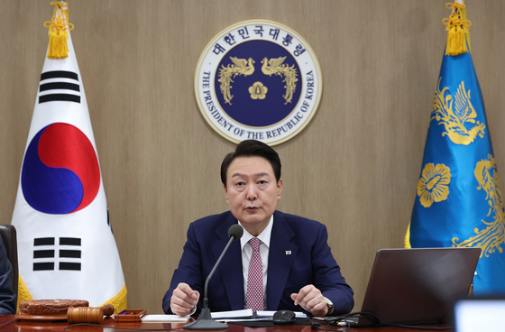 President Yoon Suk Yeol instructs ministers to work toward building a mechanism for “future-oriented cooperation” with Japan in a Cabinet meeting at the Yongsan presidential office in central Seoul Tuesday after the government announced a plan to compensate victims of wartime forced labor through a Korea-funded public foundation the previous day. [JOINT PRESS CORPS]