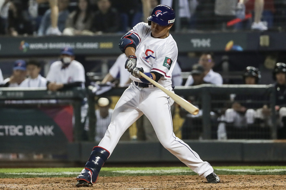 Taiwan's Wu Nien-Ting hits a two-run home run against Panama during a Pool A game in the World Baseball Classic at Taichung Stadium in Taichung, Taiwan on Wednesday.  [AP/YONHAP]