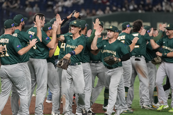 Australian players celebrate after beating Korea in a Pool B game at the World Baseball Classic in Tokyo on Thursday.  [AP/YONHAP]