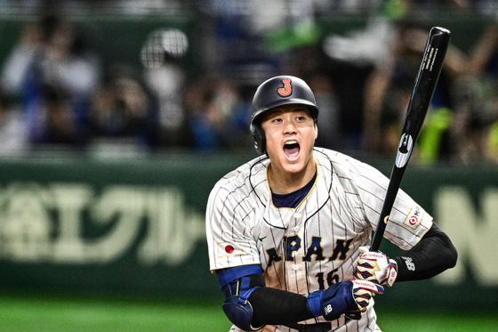Japan's Shohei Ohtani reacts during a World Baseball Classic Pool B round game against Korea at the Tokyo Dome in Tokyo on Friday.  [AFP/YONHAP]