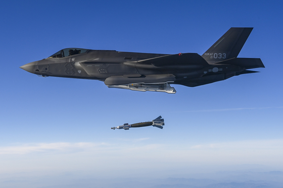 A F-35A stealth fighter jet from the South Korean Air Force fires a laser-guided GBU-12 in a demonstration of the force's ability to destroy North Korean missile transporter erector launchers during a drill on Nov. 18. [JOINT CHIEFS OF STAFF]