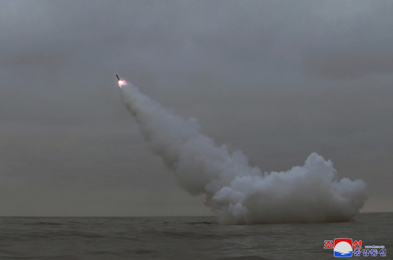 North Korea fires two ″strategic cruise missiles″ from a submarine in waters off the country's east coast, in a photo released by its official Korean Central News Agency on Monday. [YONHAP]
