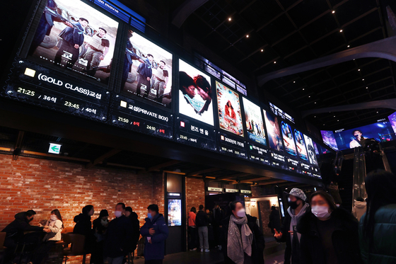 A movie theater in Yongsan District, central Seoul, displays movie posters on the wall in January. [YONHAP]