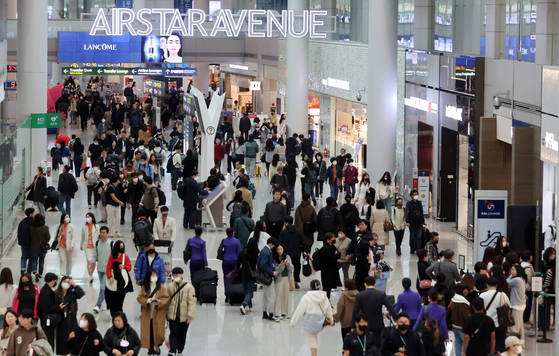 Incheon International Airport Terminal 1 bustles with travelers on March 1. [NEWS1]