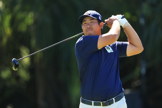 An Byeong-hun swings during the third round of The Players Championship on The Players Stadium Course at TPC Sawgrass on March 11 in Ponte Vedra Beach, Florida.  [GETTY IMAGES]