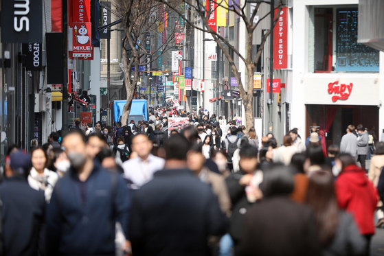 A street in Myeongdong, a shopping mecca in central Seoul, bustles with shoppers on March 10. [NEWS1]