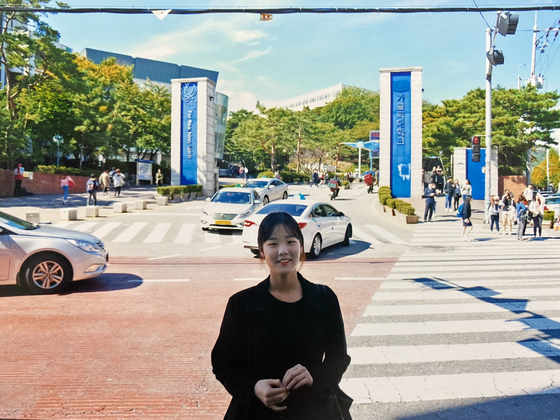 Heo Jin-yi in front of a university she attended in spring 2014, soon after she left an orphanage in Busan. [HEO JIN-YI] 