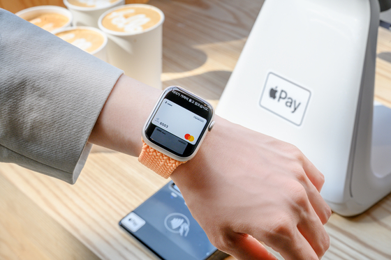 An image of Apple Pay processing through an Apple Watch [APPLE]