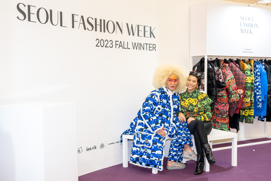 Elton Ilirjani, left, and designer Park Youn-hee of Greedilous pose during an interview with the Korea JoongAng Daily at the Dongdaemun Design Plaza in central Seoul on Friday night, during Seoul Fashion Week 2023 Fall/Winter. [SEOUL FASHION WEEK]