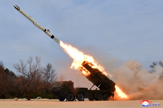 A white Hwasal-2 ″strategic″ cruise missile is fired from a transporter erector launcher in Hamhung, South Hamgyong Province, in this photo released by Pyongyang's state-controlled Korean Central News Agency on Friday. [YONHAP]